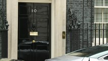 Theresa May leaves Downing Street for PMQs