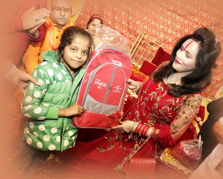 Shri Radhe Maa donate free School bag and put a smile on a children's face