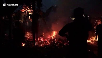 Locals from Bali launch fireballs at each other in a ritual aptly named 'fire wars'