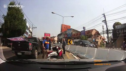 Good Samaritans subdue motorcyclist who smashed car window in road rage