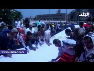 وزير الزراعة ومحافظ الفيوم يوقعان على أطول علم مصرى
