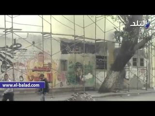 صدى البلد | طلاء صور الشهداء وجرافيتى الثورة بشارع محمد محمود