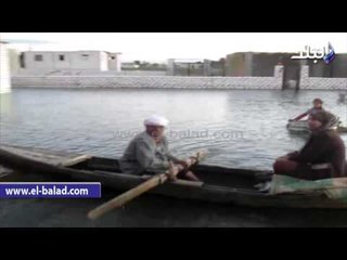 صدى البلد | مصرف "القاطع" يغرق 6 قرى بالفيوم..والاهالى يتنقلون ب"المراكب"