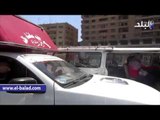 صدى البلد | شباب الفيوم يوزعون الورود والأعلام احتفالا بذكرى تحرير سيناء