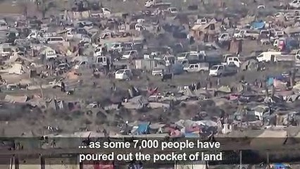 Rare footage shows people walking inside last IS-held territory in Syria's Baghouz
