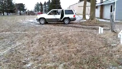 Car Tied To Tree Drives Off