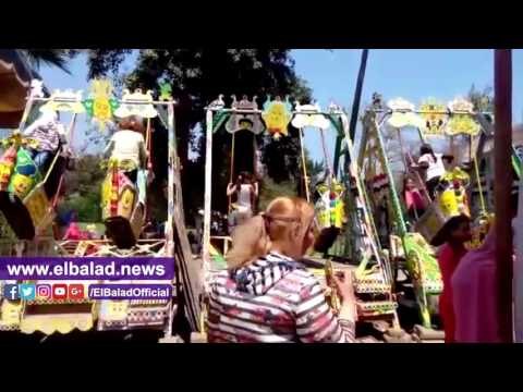 صدى البلد | أطفال القناطر يلعبون داخل ملاهى القناطر