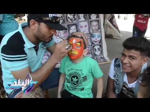 صدى البلد | الأطفال يرسمون وجوههم فى حديقة الحيوان احتفالا بالعيد