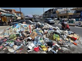 صدى البلد |العربجية والقمامة تحيط بمحلات الخبز ومركز الثقافة بالقومية