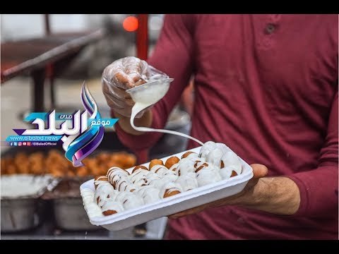 صدى البلد | شباب يبتكرون طريقة جديدة لبيع الزلابية في فيصل