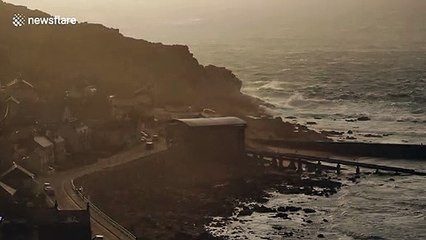 UK coastline thrashed by Storm Gareth during sunset