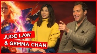 'You're damn right I do!': Jude Law and Gemma Chan talk wearing their own Captain Marvel merch!