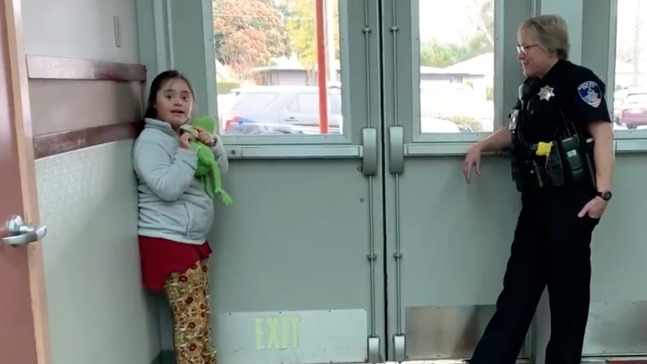 Heartwarming Moment Officer Comforts Student With Down Syndrome