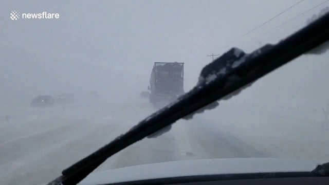 Massive trucks nearly collide during intense Denver blizzard