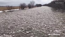 River gets overwhelmed by ice jam flooding