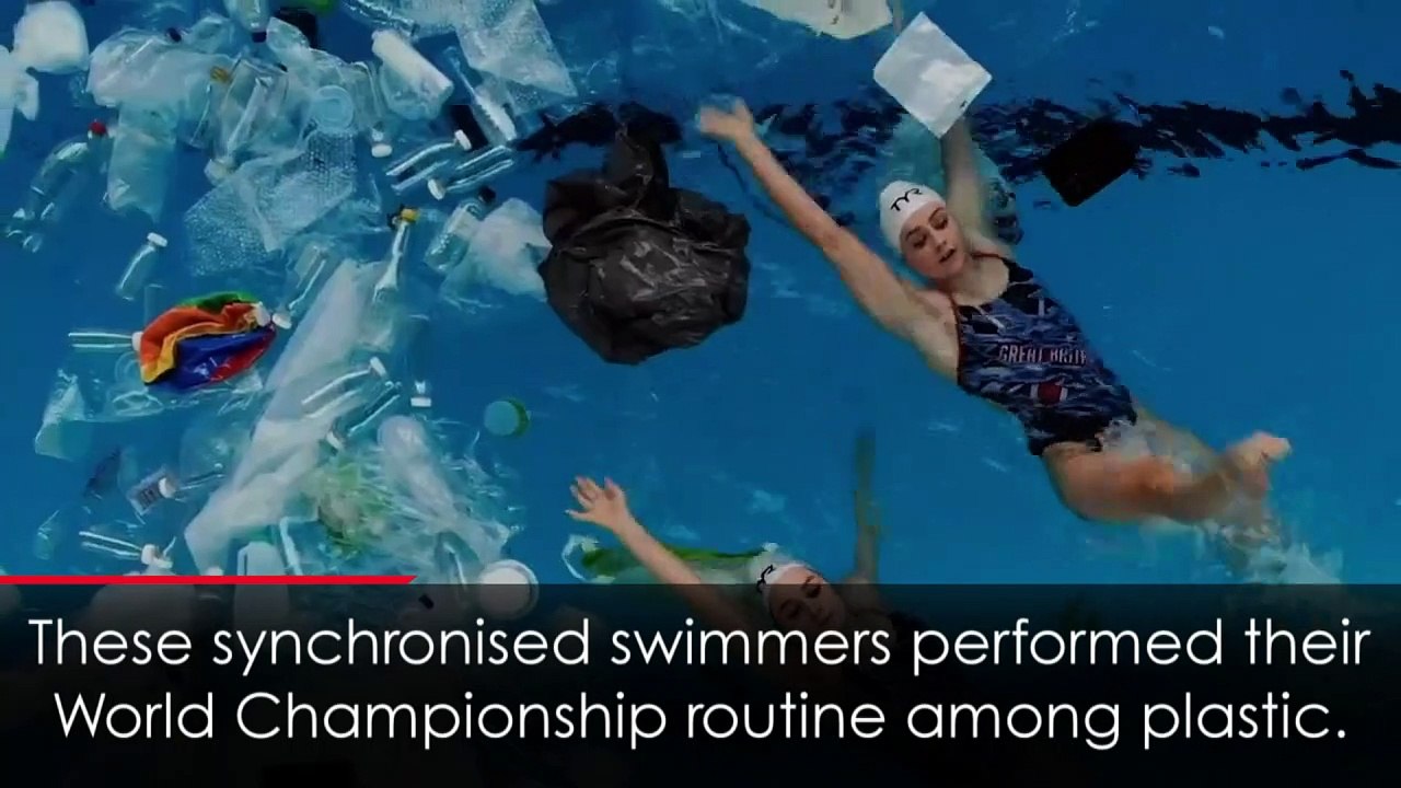 Synchronised swimmers perform in pool full of plastic