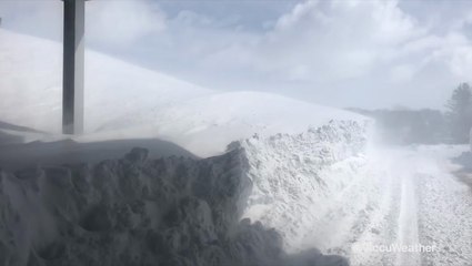 Giant snow drifts form on closed Interstate 80