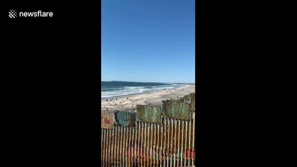 Scores of Honduran migrants sprint across US border from Mexico