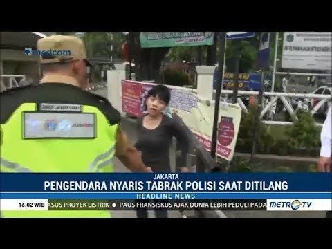 Hindari Razia, Pengendara Mobil Nyaris Tabrak Polisi