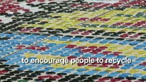 Rug made of 25 thousand plastic bottle caps on display