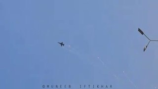 Pakistan Air Force's F-16 Block 15 ADF performing Vertical Rolls over parade ground