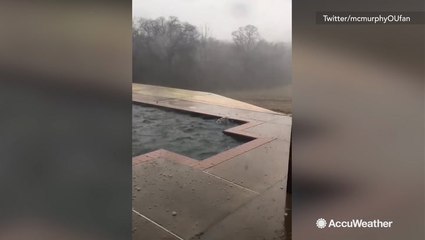 Listen as golf ball size hail hits roof, giving this homeowner a scare.