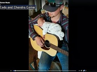 Aspiring country star uses guitar to lull baby daughter to sleep in viral video