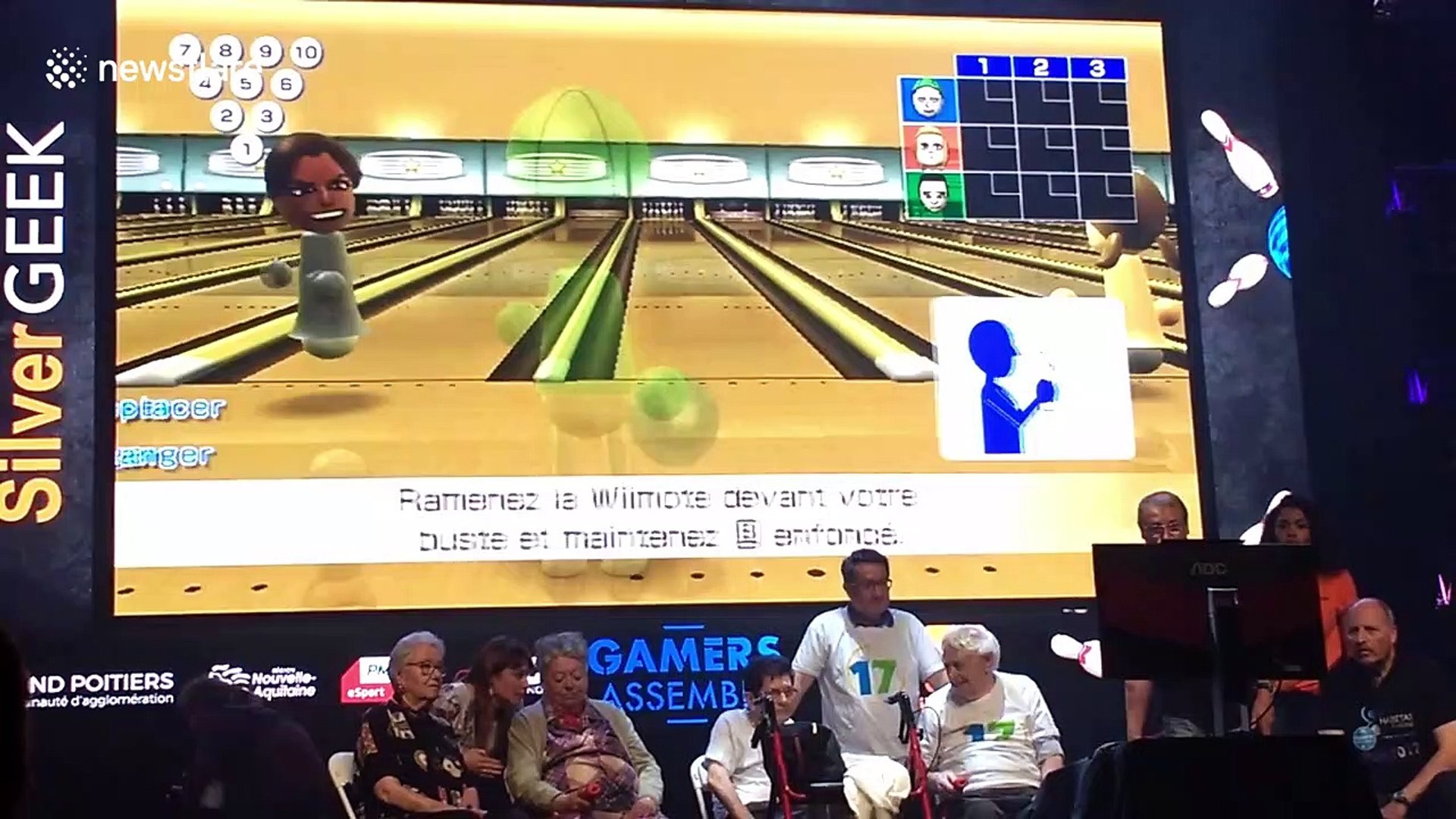 Crowd goes wild as elderly gamer scores a strike a bowling game competition  - video Dailymotion