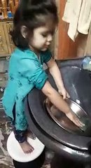 Cute little girl washing utensils - great video