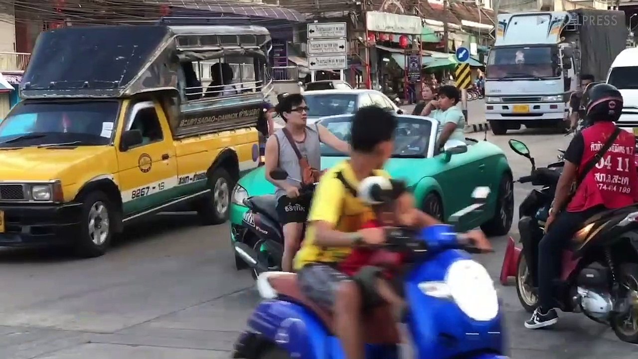 Young Boy Left In Daddy's Sports Car Directs Traffic