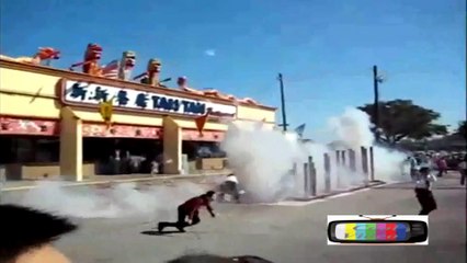 Asian woman falls during fireworks