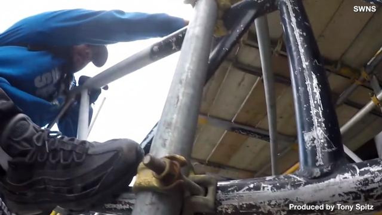 Vertigo Inducing Video of Thrillseekers Climbing 650ft Tower... in a Hail Storm