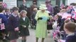 The Queen feeds horses at Manor Farm Stables in Somerset