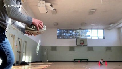 Canadian dad sinks amazing trick shot by throwing a rugby ball through basketball hoop