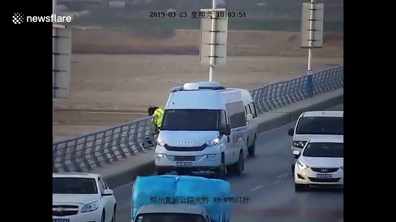 Heroic woman grabs suicidal man to save him from jumping off bridge