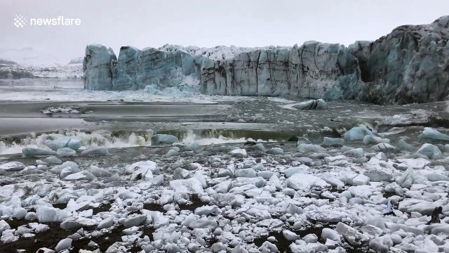 Moment massive glacier collapses in Iceland lagoon, sending tourists fleeing in panic