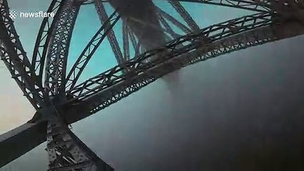 Fearless free-climber scales 'bridge over the clouds' in France
