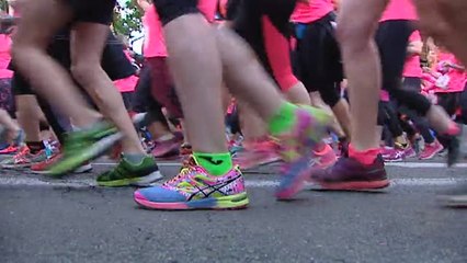 La carrera de la mujer tiñe de rosa las calles de Madrid