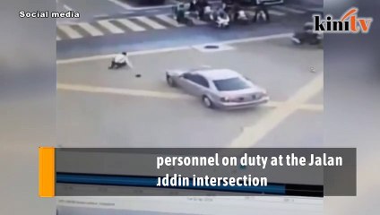 Car slams into on-duty traffic personnel in KL