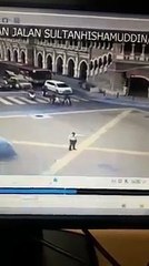Shocking moment a car rams into a traffic cop in KL