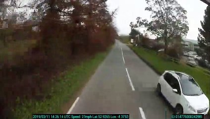 Car rolls over on Welsh country lane right in the path of oncoming lorry