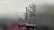 Chopper flying too low blows bollards into path of marathon runners in China