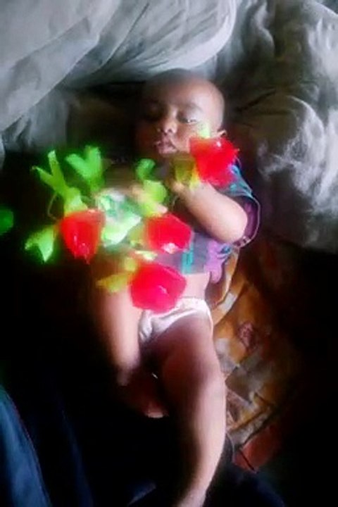 Small children playing with flowers