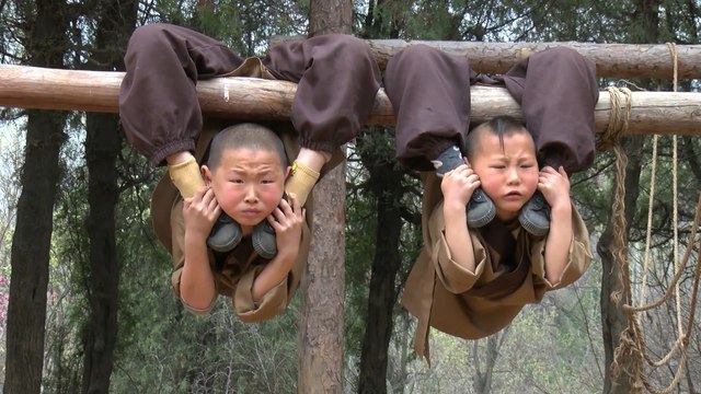 Young Chinese Shaolin monks display amazing feats of flexibility