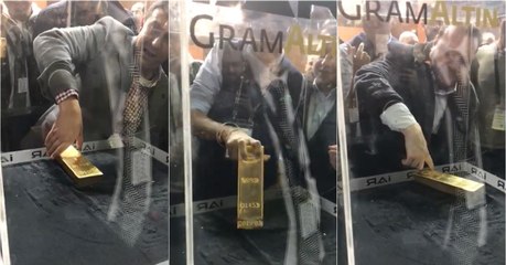 Colocaram cabines com barras de ouro de 12 kg para quem as conseguir tirar