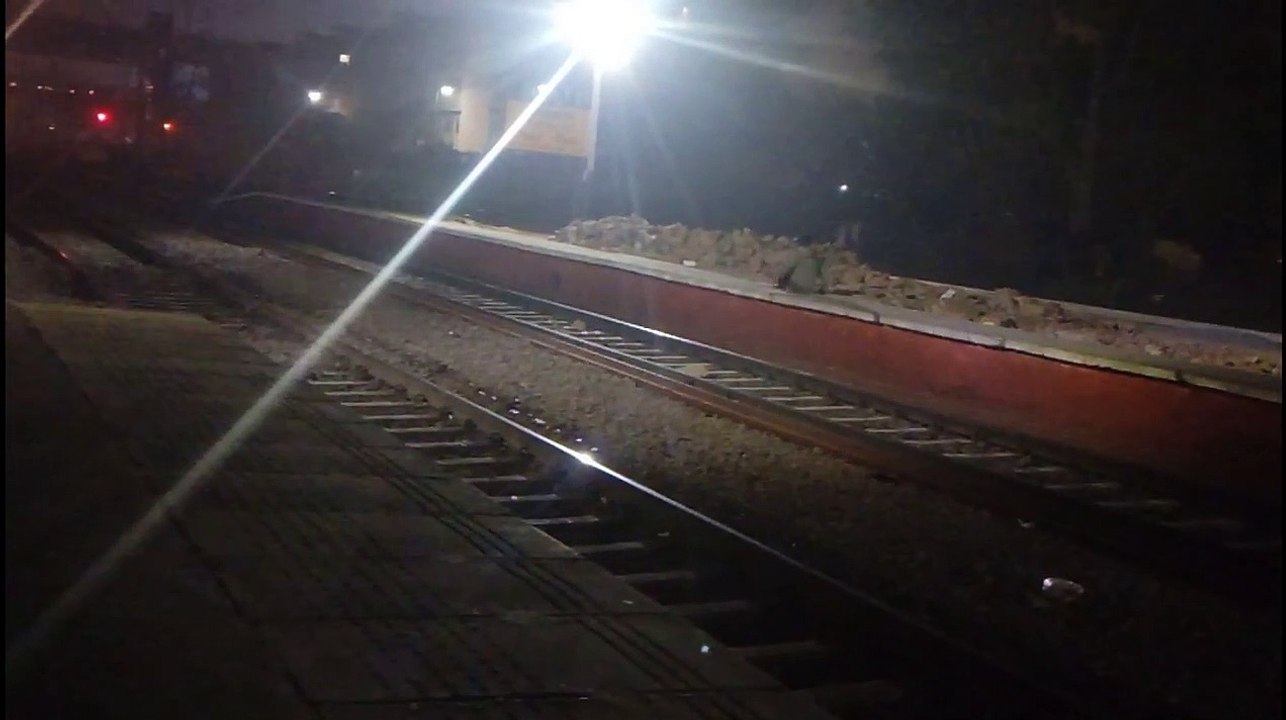 Man sitting on Platform During Gatiman Express Crossing