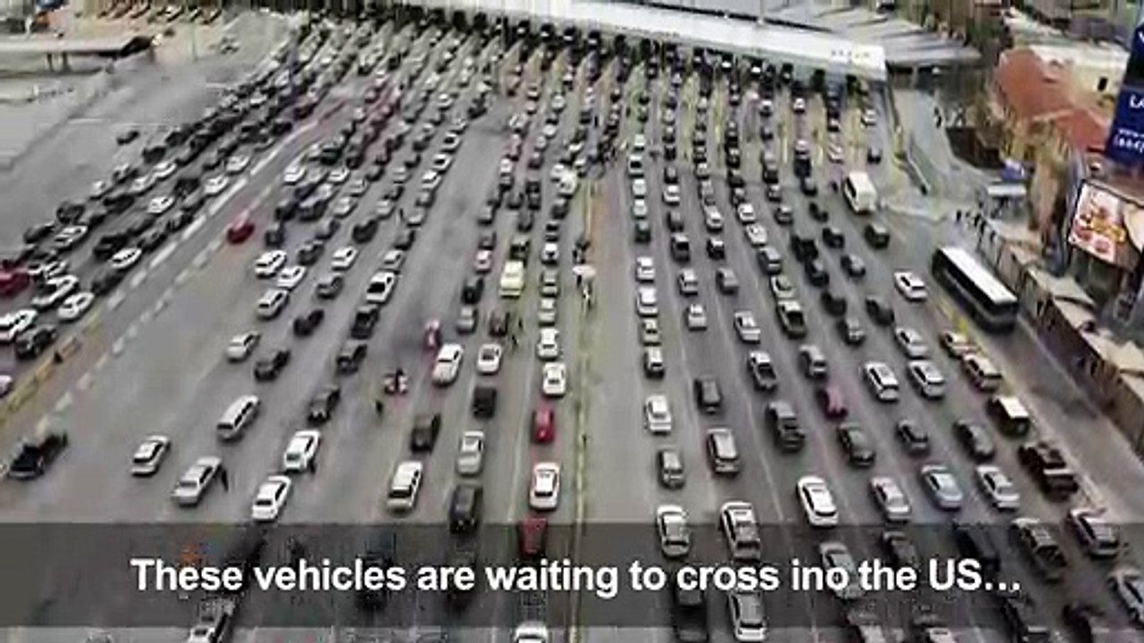 Hundreds of cars and barbed wire at US-Mexico border