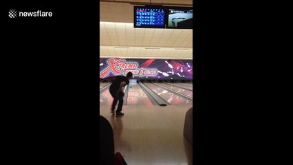 Man makes awesome 'double-ball' bowling strike in Luxembourg