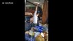 Kung fu master shows off Tai Chi moves while spinning roti pirata dough