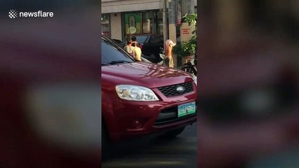 Children bathe in leaking water pipe in drought-hit Philippines